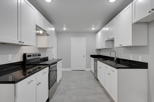 1729 Foster Dr, Arlington, TX 76012 - kitchen with appliances with stainless steel finishes, a sink, under cabinet range hood, recessed lighting, and baseboards