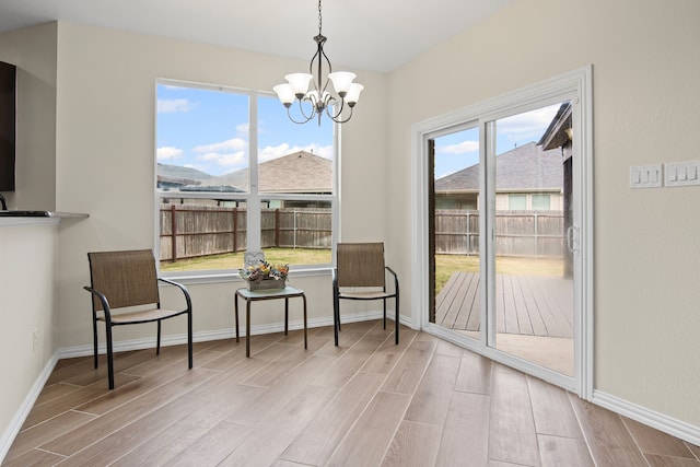 9016 N Stone Mill Ln, Fort Worth, TX 76179 - sitting room with wood finished floors and a chandelier