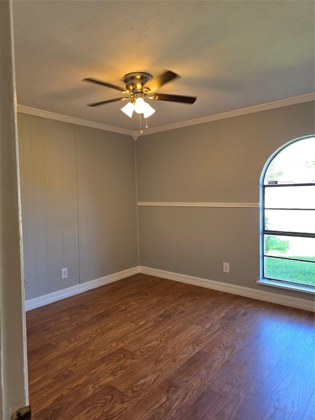 5501 Miami Dr, Rowlett, TX 75088 - spare room with dark wood finished floors, ceiling fan, baseboards, and crown molding