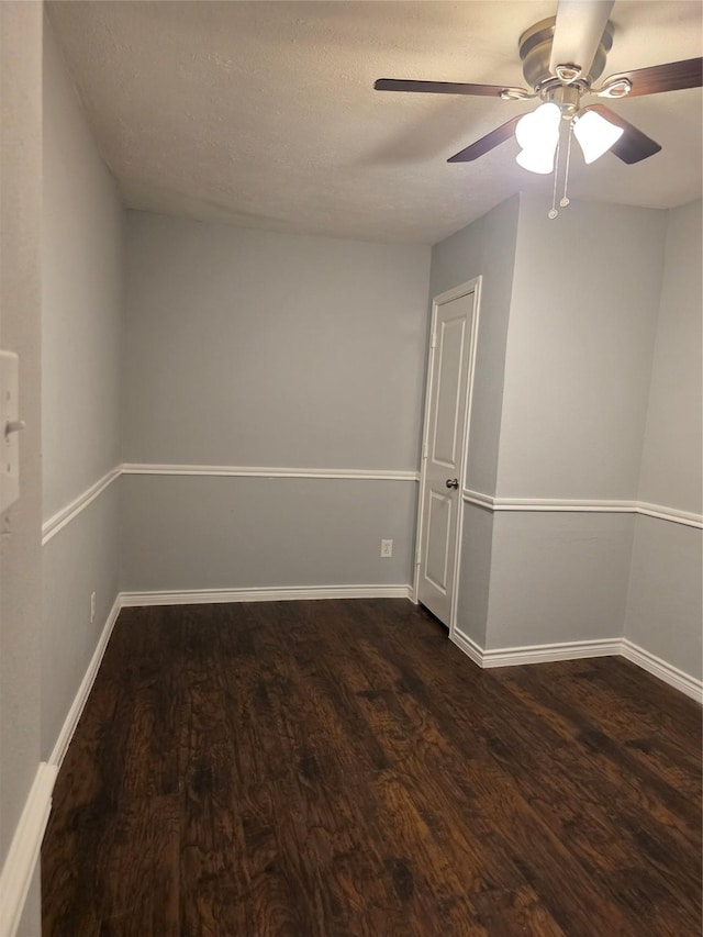 5501 Miami Dr, Rowlett, TX 75088 - unfurnished room with dark wood-style flooring, ceiling fan, and baseboards