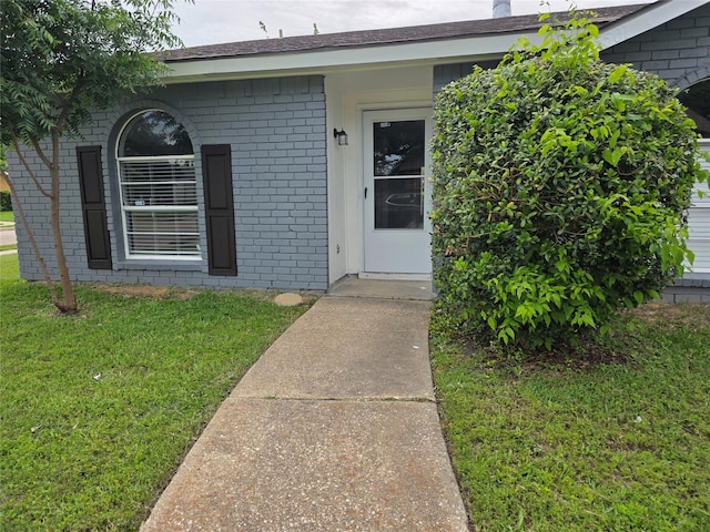 5501 Miami Dr, Rowlett, TX 75088 - entrance to property featuring brick siding and a yard