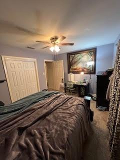 214 Pecos St, Garland, TX 75041 - carpeted bedroom with ceiling fan and a closet
