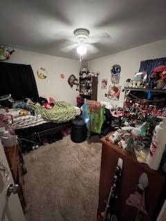214 Pecos St, Garland, TX 75041 - carpeted bedroom with a ceiling fan