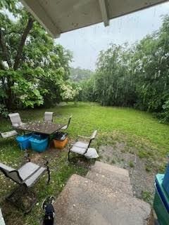 view of grassy yard with a patio