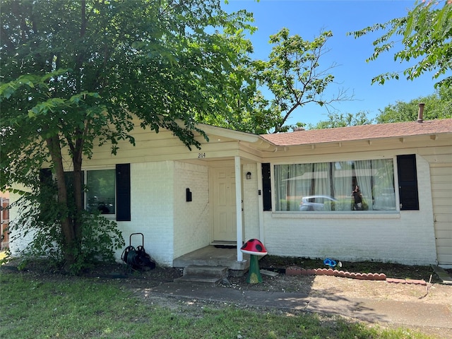 214 Pecos St, Garland, TX 75041 - view of front facade featuring brick siding