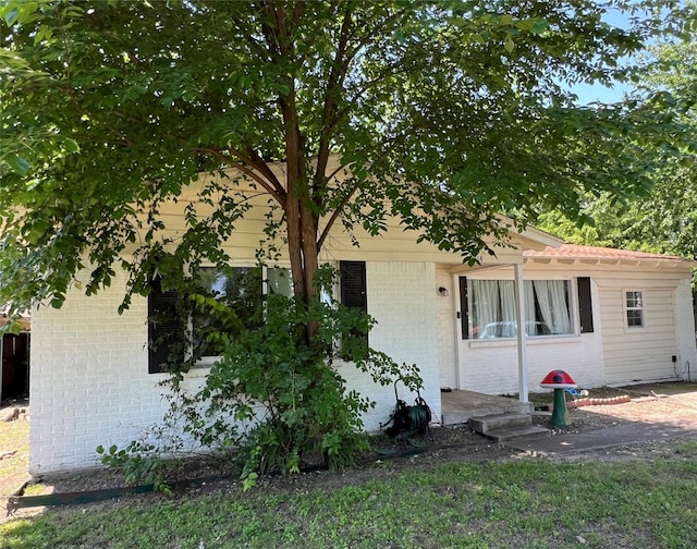 214 Pecos St, Garland, TX 75041 - view of front of property with brick siding
