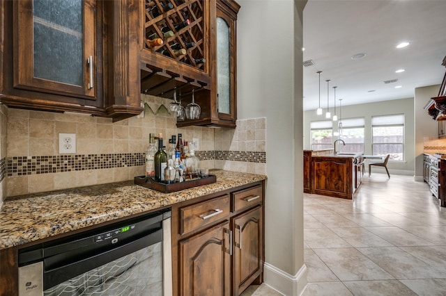 indoor dry bar featuring wine cooler, tasteful backsplash, baseboards, light tile patterned flooring, and recessed lighting