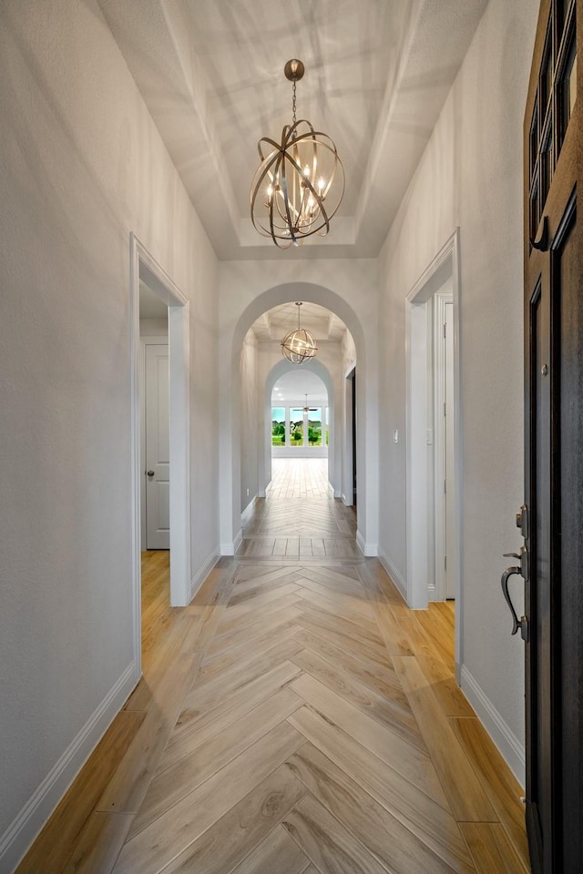 1116 Lake Hills Trl, Roanoke, TX 76262 - hallway featuring arched walkways, a chandelier, and baseboards