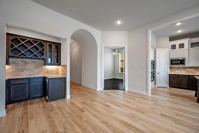 1116 Lake Hills Trl, Roanoke, TX 76262 - kitchen with built in microwave, tasteful backsplash, a ceiling fan, light wood-style flooring, and recessed lighting