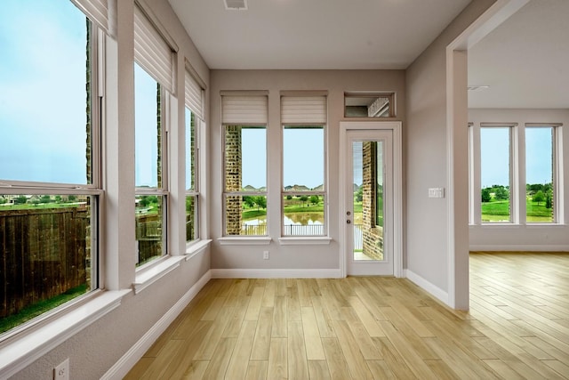 1116 Lake Hills Trl, Roanoke, TX 76262 - unfurnished sunroom with wood finished floors and baseboards