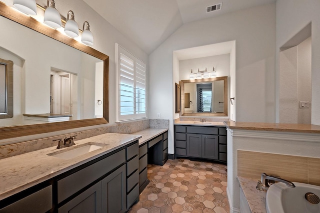 1116 Lake Hills Trl, Roanoke, TX 76262 - full bath featuring vaulted ceiling, two vanities, and a bathtub