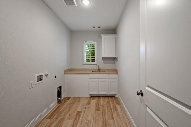 1116 Lake Hills Trl, Roanoke, TX 76262 - laundry area with hookup for an electric dryer, light wood finished floors, baseboards, and hookup for a washing machine