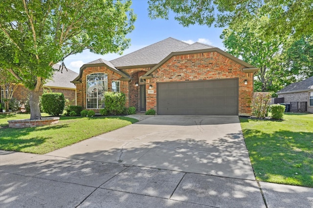 view of front of home with a front lawn, driveway, a garage, and brick siding