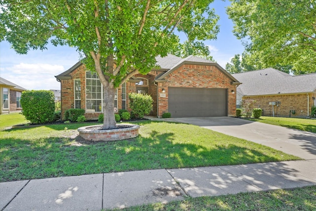 traditional-style house featuring brick siding, a garage, and a front yard