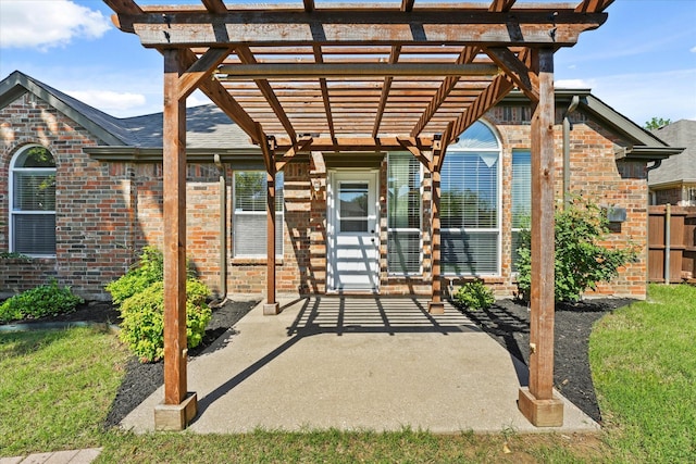 view of patio featuring a pergola and fence