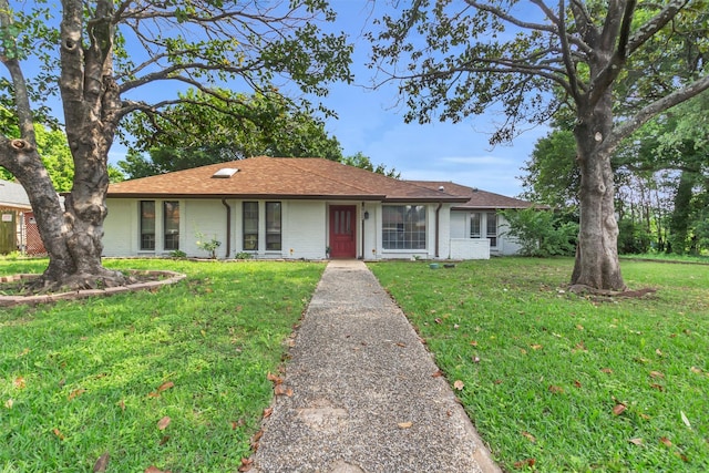 1032 Peach Ln, Desoto, TX 75115 - single story home featuring a front lawn, brick siding, and roof with shingles