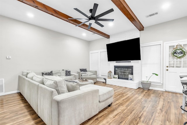 1032 Peach Ln, Desoto, TX 75115 - living room featuring beam ceiling, ceiling fan, wood finished floors, a fireplace, and recessed lighting