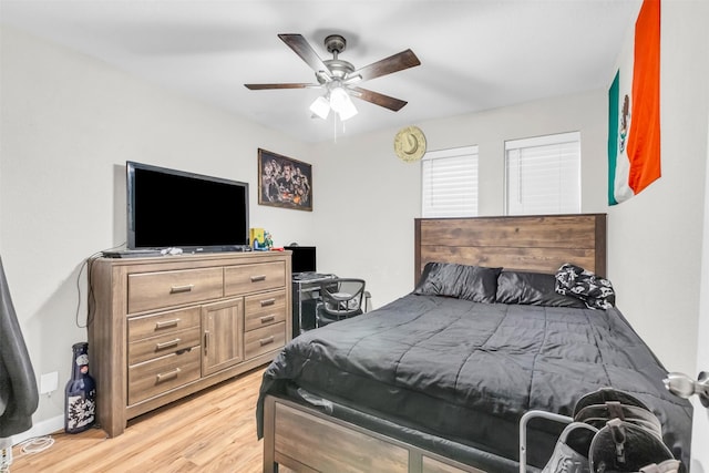 1032 Peach Ln, Desoto, TX 75115 - bedroom with light wood finished floors and a ceiling fan