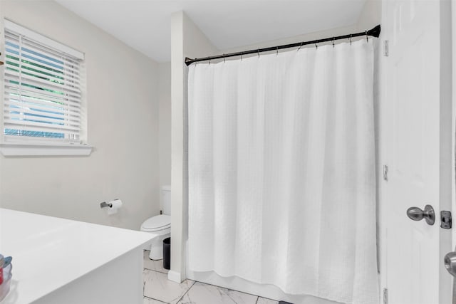 1032 Peach Ln, Desoto, TX 75115 - full bath with marble look tile flooring, toilet, a shower with shower curtain, and vanity