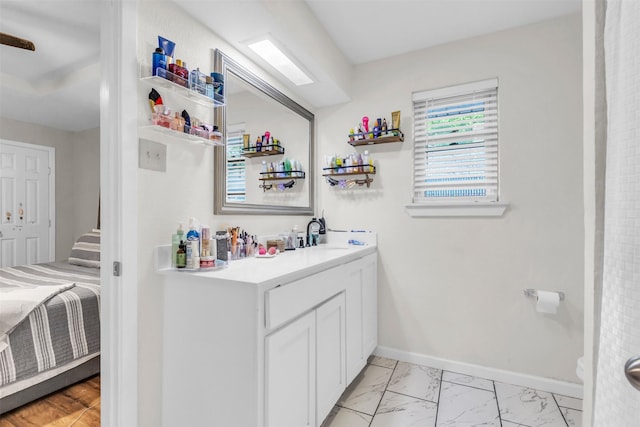 1032 Peach Ln, Desoto, TX 75115 - full bathroom with marble finish floors, vanity, and baseboards