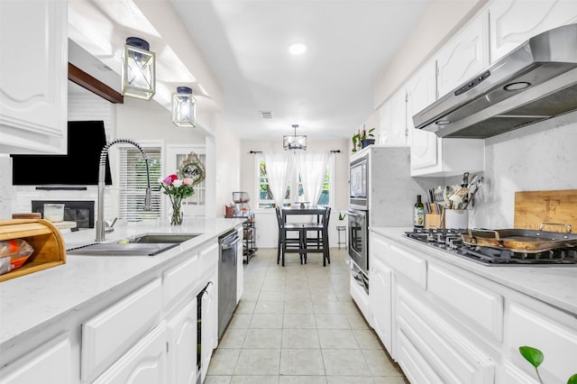 1032 Peach Ln, Desoto, TX 75115 - kitchen with under cabinet range hood, a sink, stainless steel appliances, light tile patterned floors, and white cabinets