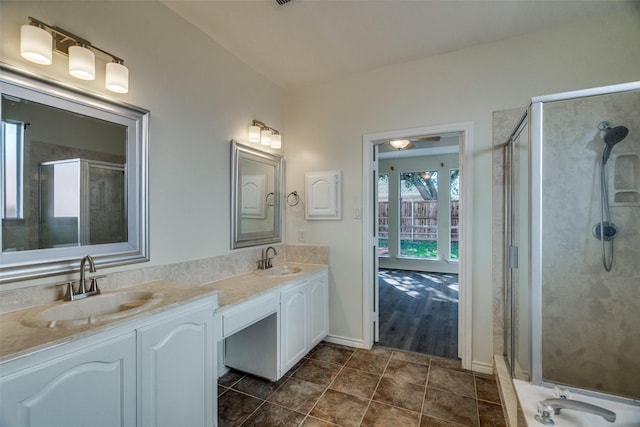 4804 Nocona Dr, Plano, TX 75024 - full bathroom featuring double vanity, a shower stall, tile patterned floors, and baseboards