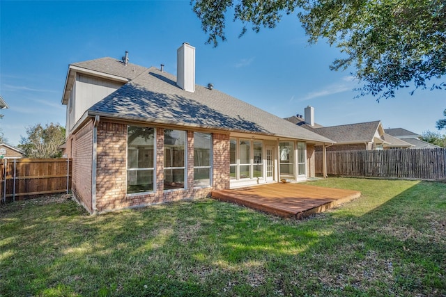 4804 Nocona Dr, Plano, TX 75024 - back of property with a chimney, a wooden deck, brick siding, and roof with shingles