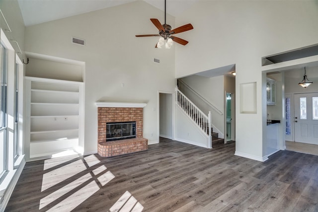 4804 Nocona Dr, Plano, TX 75024 - unfurnished living room featuring high vaulted ceiling, stairs, wood finished floors, and ceiling fan