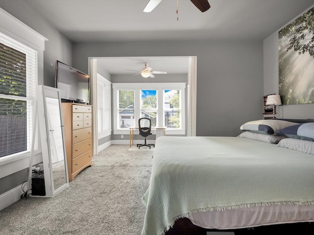 1942 Fairmount Ave, Fort Worth, TX 76110 - bedroom featuring light colored carpet, baseboards, and ceiling fan