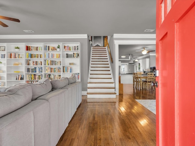 1942 Fairmount Ave, Fort Worth, TX 76110 - living room with a ceiling fan, wood finished floors, stairway, and ornamental molding