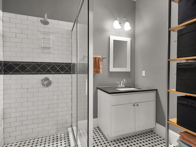 1942 Fairmount Ave, Fort Worth, TX 76110 - bathroom featuring a shower stall, vanity, and baseboards