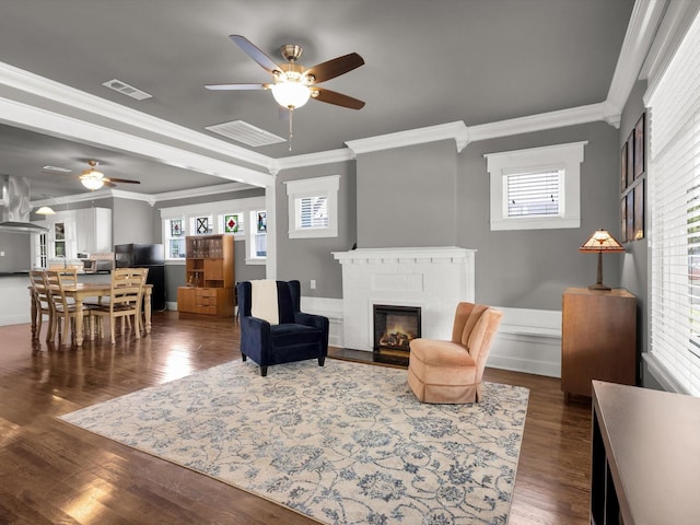 1942 Fairmount Ave, Fort Worth, TX 76110 - living area with a ceiling fan, ornamental molding, a brick fireplace, and dark wood-style floors