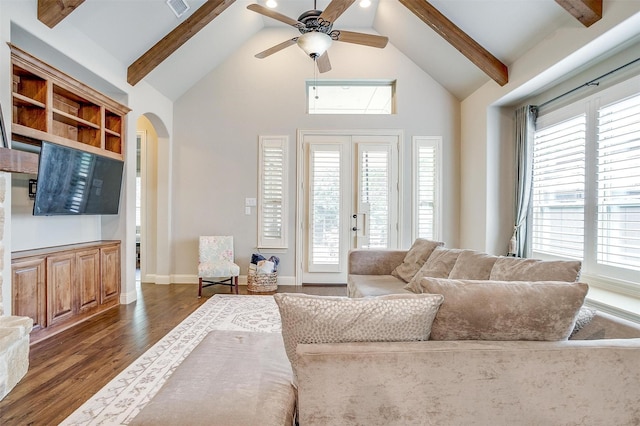 4701 Trevor Trl, Grapevine, TX 76051 - living room with high vaulted ceiling, dark wood-style floors, arched walkways, beamed ceiling, and a ceiling fan