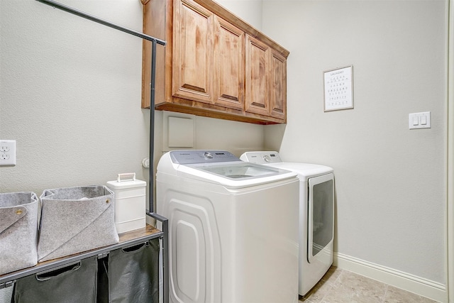 4701 Trevor Trl, Grapevine, TX 76051 - laundry room featuring separate washer and dryer, cabinet space, and baseboards