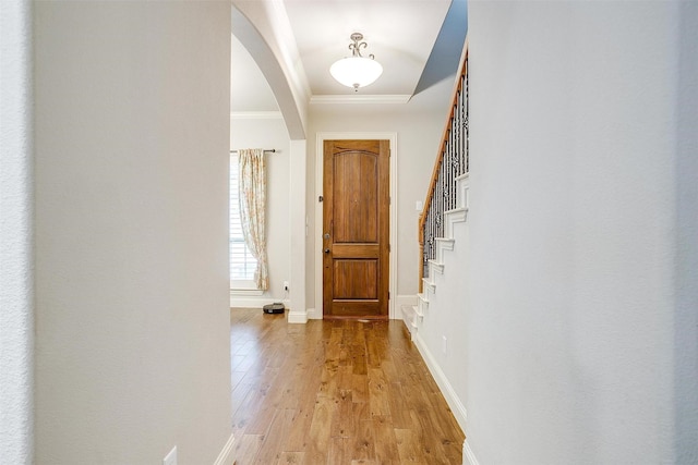 4701 Trevor Trl, Grapevine, TX 76051 - foyer featuring arched walkways, crown molding, light wood-style flooring, baseboards, and stairs