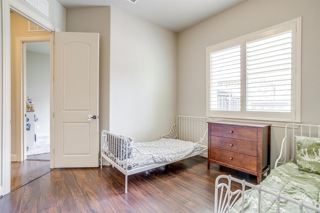4701 Trevor Trl, Grapevine, TX 76051 - bedroom featuring dark wood-type flooring and multiple windows