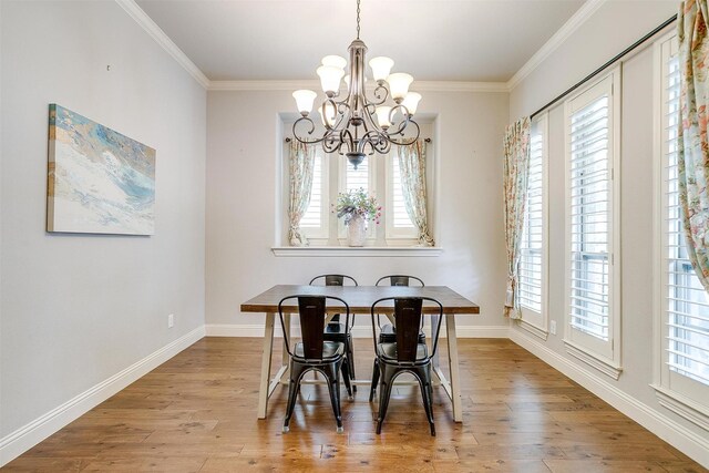 4701 Trevor Trl, Grapevine, TX 76051 - dining area with a chandelier, healthy amount of natural light, crown molding, wood finished floors, and baseboards