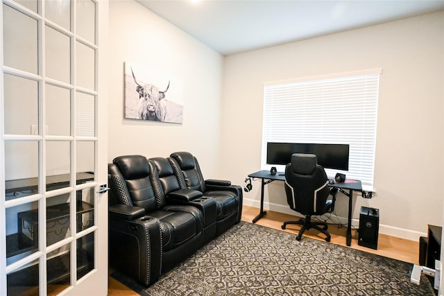 home office with wood finished floors and baseboards