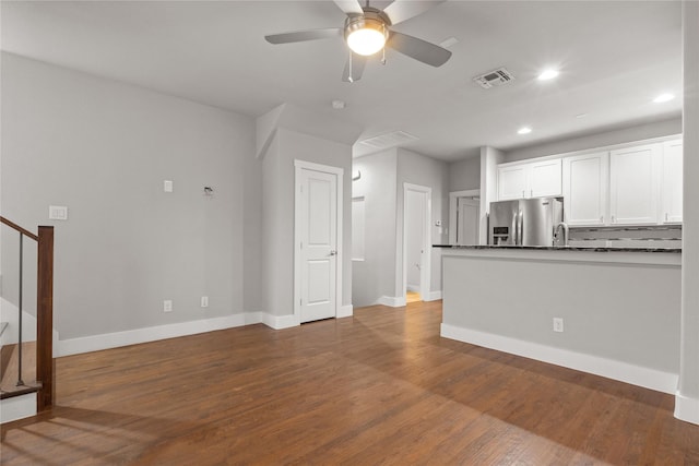 1317 Palm Canyon Dr, Dallas, TX 75204 - unfurnished living room featuring baseboards, stairs, dark wood-style floors, ceiling fan, and recessed lighting