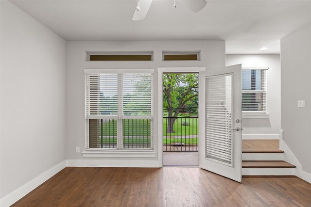 1317 Palm Canyon Dr, Dallas, TX 75204 - doorway with ceiling fan, baseboards, and wood finished floors