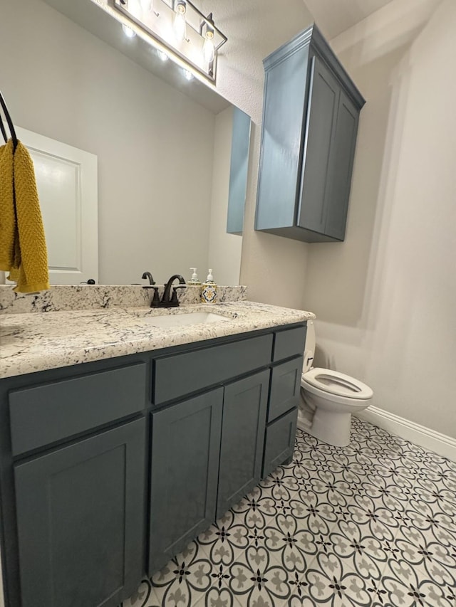 252 Harvard Ln, Springtown, TX 76082 - bathroom with baseboards, toilet, and vanity