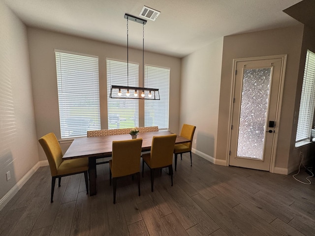 252 Harvard Ln, Springtown, TX 76082 - dining space with dark wood finished floors, baseboards, and a chandelier