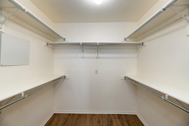 4541 Grainland Ct, Fort Worth, TX 76179 - walk in closet with dark wood-type flooring