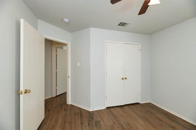 4541 Grainland Ct, Fort Worth, TX 76179 - unfurnished bedroom featuring wood finished floors, baseboards, a closet, and ceiling fan