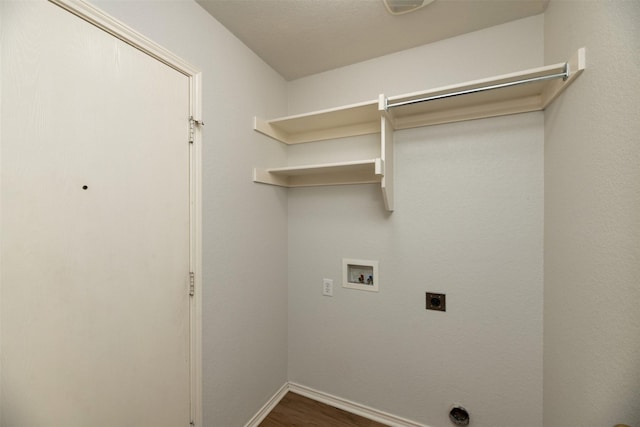 4541 Grainland Ct, Fort Worth, TX 76179 - clothes washing area featuring electric dryer hookup, washer hookup, dark wood-style flooring, and baseboards