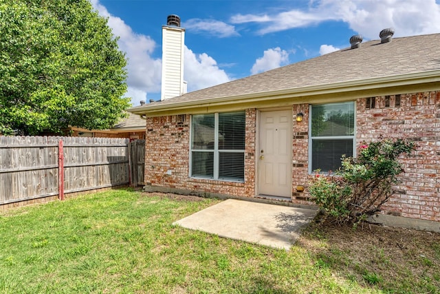 4541 Grainland Ct, Fort Worth, TX 76179 - rear view of house featuring brick siding, a shingled roof, a chimney, and a patio