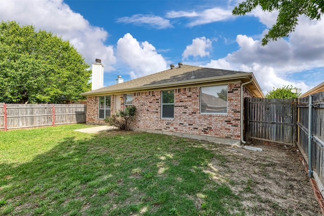 4541 Grainland Ct, Fort Worth, TX 76179 - rear view of house featuring brick siding, a chimney, and a shingled roof