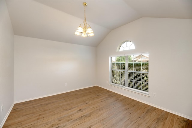 4541 Grainland Ct, Fort Worth, TX 76179 - empty room featuring a chandelier, lofted ceiling, wood finished floors, and baseboards