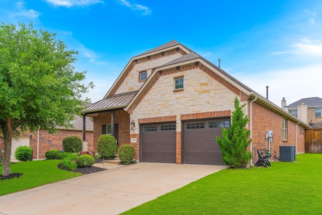 5604 Ridgeson Dr, Mckinney, TX 75071 - view of front of home with a front yard, driveway, a standing seam roof, and brick siding