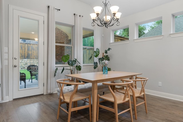 5604 Ridgeson Dr, Mckinney, TX 75071 - dining area with wood finished floors, a chandelier, and baseboards